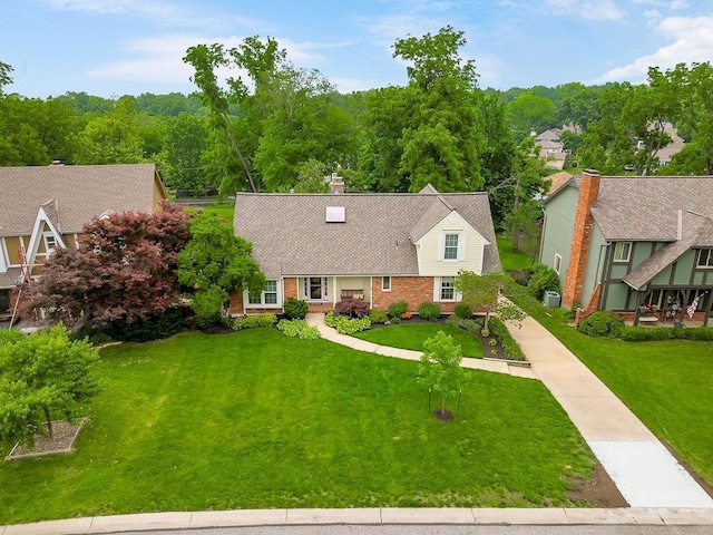 8122 Parkhill Rd, Lenexa, KS 66215 - view of front facade featuring a front lawn and brick siding