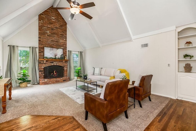 8122 Parkhill Rd, Lenexa, KS 66215 - living room featuring ceiling fan, wood finished floors, plenty of natural light, and a brick fireplace