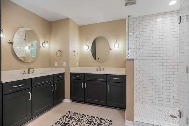8122 Parkhill Rd, Lenexa, KS 66215 - bathroom featuring a walk in shower, tile patterned floors, and two vanities