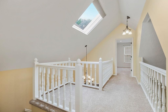 8122 Parkhill Rd, Lenexa, KS 66215 - hall featuring lofted ceiling, a skylight, carpet, and an upstairs landing