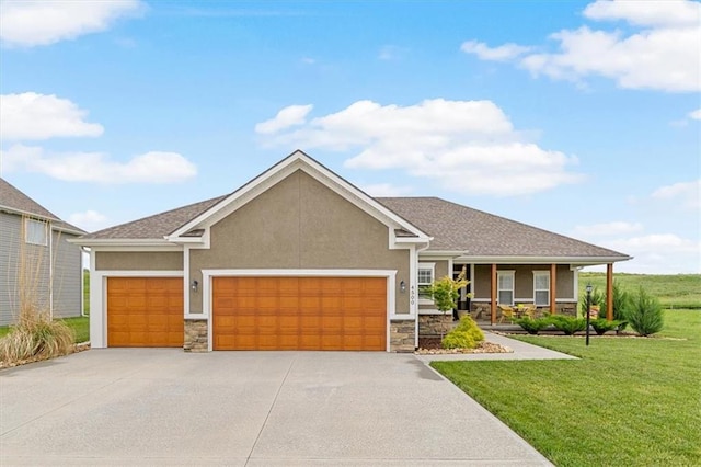 4500 Valley Ridge Dr, Saint Joseph, MO 64505 - craftsman inspired home with stone siding, stucco siding, a garage, and driveway