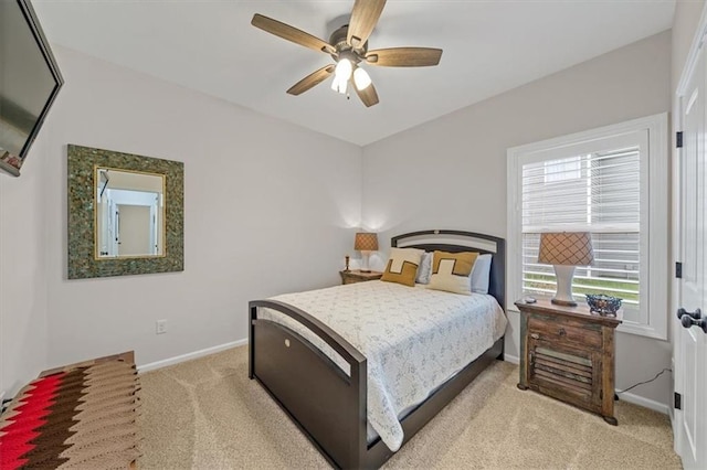 4500 Valley Ridge Dr, Saint Joseph, MO 64505 - bedroom featuring light carpet, baseboards, and a ceiling fan
