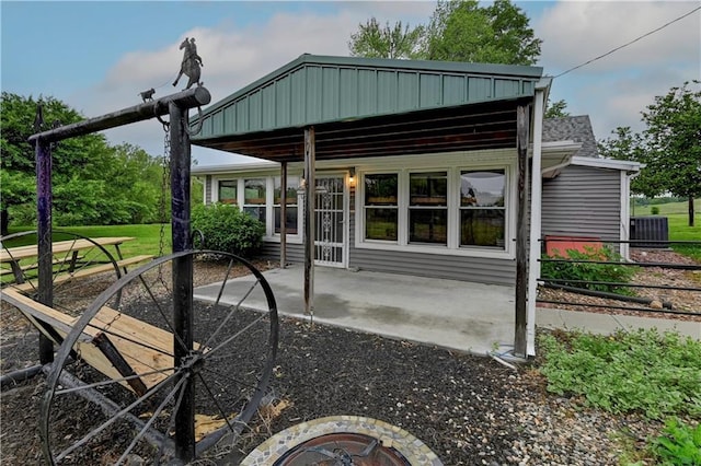 10855 72nd Rd, Agency, MO 64401 - rear view of house featuring a patio and central AC