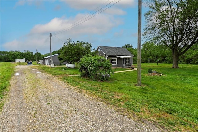 10855 72nd Rd, Agency, MO 64401 - view of front of house featuring driveway and a front yard