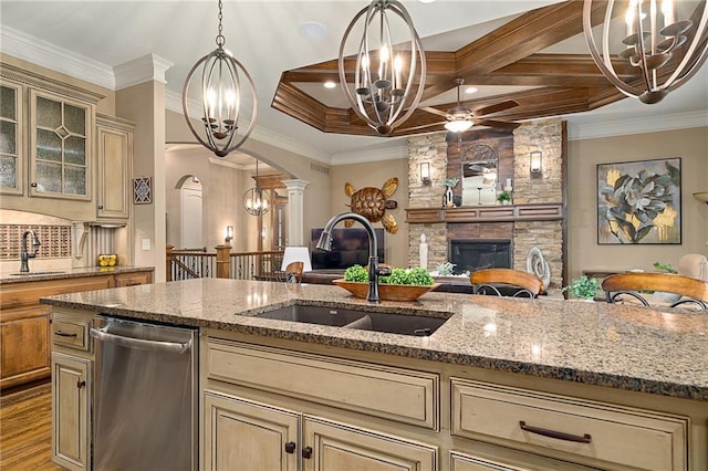 3116 W 137th St, Leawood, KS 66224 - kitchen featuring a chandelier, stainless steel dishwasher, cream cabinets, a sink, and crown molding