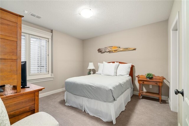 3116 W 137th St, Leawood, KS 66224 - bedroom featuring carpet flooring, a textured ceiling, and baseboards