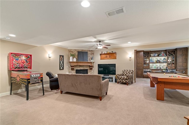 3116 W 137th St, Leawood, KS 66224 - living area with light colored carpet, a fireplace, crown molding, a ceiling fan, and recessed lighting
