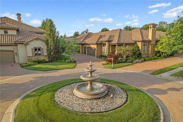 3116 W 137th St, Leawood, KS 66224 - view of front of house featuring stucco siding, a tiled roof, stone siding, and a chimney