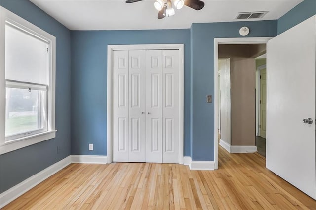 906 W 84th St, Kansas City, MO 64114 - unfurnished bedroom featuring baseboards, a closet, light wood-style flooring, and ceiling fan