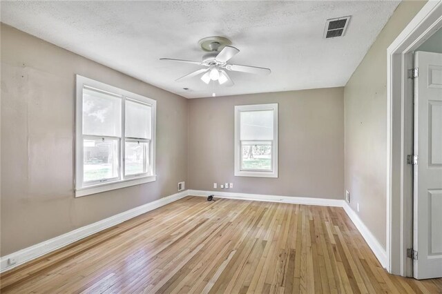 906 W 84th St, Kansas City, MO 64114 - empty room with ceiling fan, light wood-style floors, and baseboards