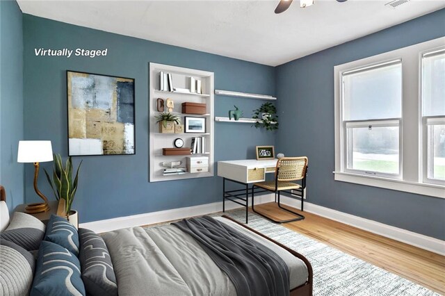906 W 84th St, Kansas City, MO 64114 - bedroom with wood finished floors and baseboards