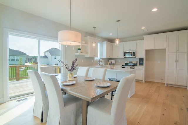 16721 Pinehurst Dr, Basehor, KS 66007 - dining room featuring recessed lighting and light wood-style flooring