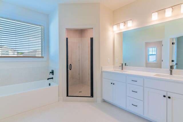 16721 Pinehurst Dr, Basehor, KS 66007 - bathroom with a shower stall, a garden tub, double vanity, and tile patterned floors