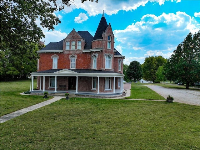 433 W State St, Troy, KS 66087 - victorian-style house featuring covered porch, a front lawn, and brick siding