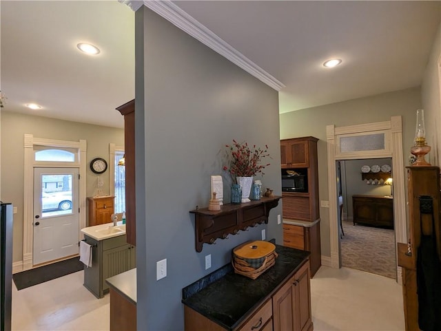 433 W State St, Troy, KS 66087 - hall with recessed lighting, ornamental molding, a sink, and baseboards
