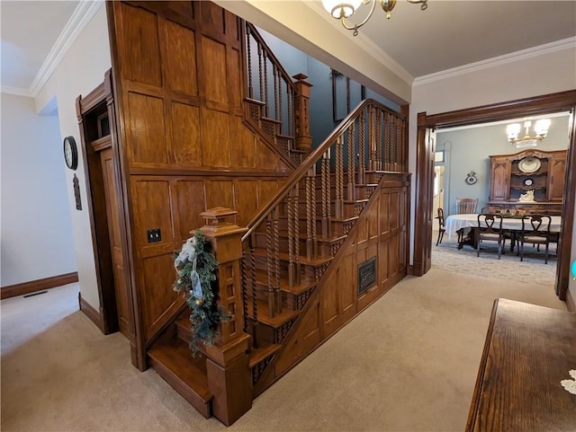 433 W State St, Troy, KS 66087 - stairs with carpet, a chandelier, crown molding, and baseboards