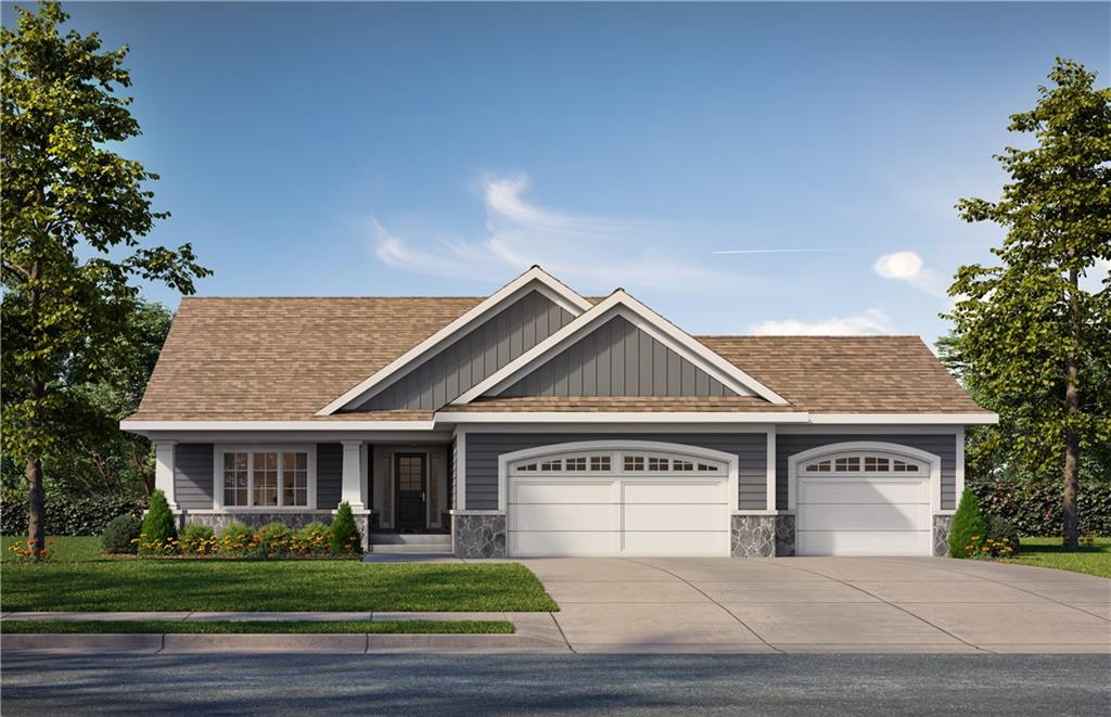 11207 Trevor Dr, Peculiar, MO 64078 - craftsman inspired home with a garage, stone siding, driveway, and a front lawn