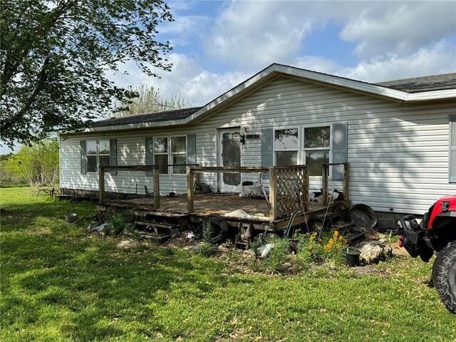 476 170th St, Fort Scott, KS 66701 - back of property featuring a deck and a lawn