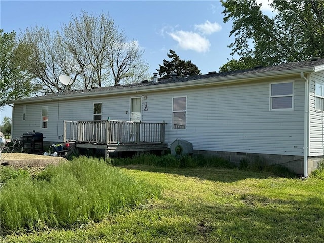 476 170th St, Fort Scott, KS 66701 - back of house with a deck, a yard, and crawl space