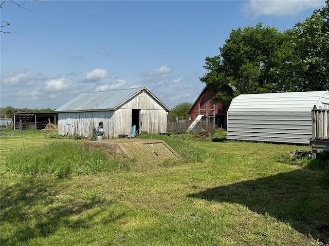 476 170th St, Fort Scott, KS 66701 - view of green lawn with an outdoor structure and a pole building