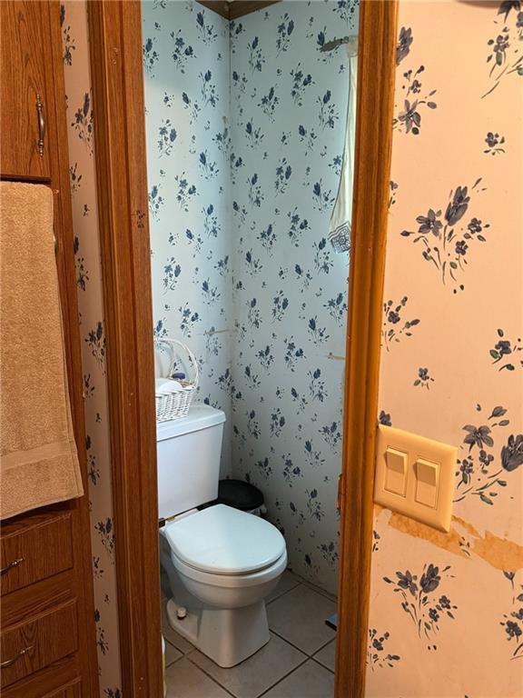 476 170th St, Fort Scott, KS 66701 - bathroom with tile patterned floors, toilet, and wallpapered walls