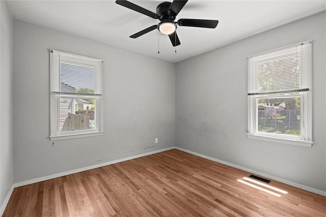17207 E Swope Ln, Independence, MO 64056 - spare room with wood finished floors, baseboards, and ceiling fan