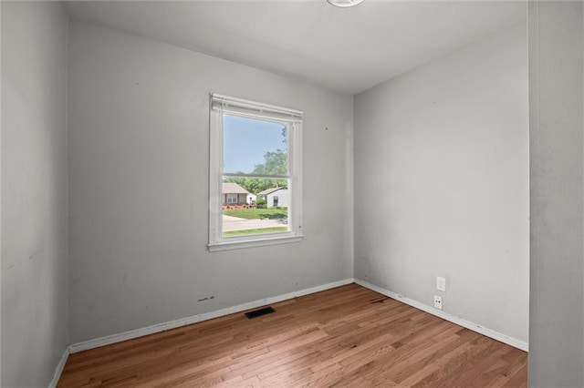 17207 E Swope Ln, Independence, MO 64056 - empty room with wood finished floors and baseboards
