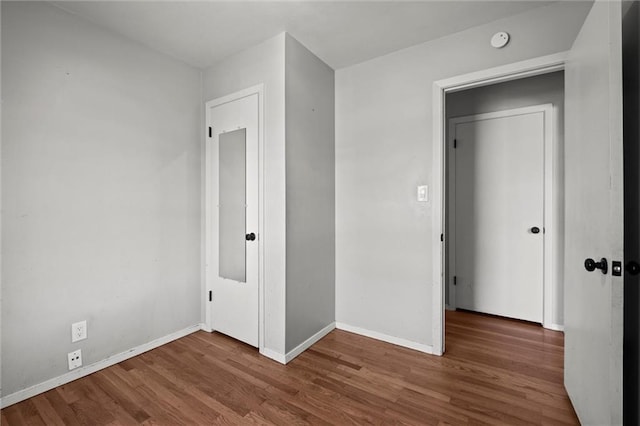 17207 E Swope Ln, Independence, MO 64056 - unfurnished bedroom with wood finished floors and baseboards