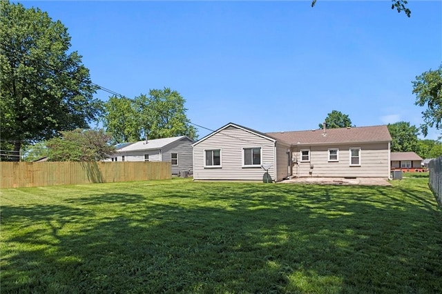 17207 E Swope Ln, Independence, MO 64056 - back of house featuring a patio area and central AC