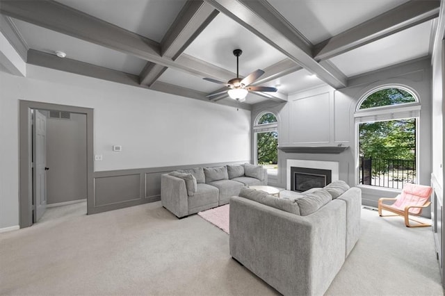 6221 W 126th Ter, Overland Park, KS 66209 - living area featuring coffered ceiling, plenty of natural light, a decorative wall, a large fireplace, and beam ceiling