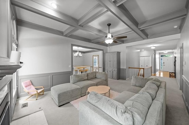 6221 W 126th Ter, Overland Park, KS 66209 - carpeted living room with coffered ceiling, a chandelier, beamed ceiling, wainscoting, and ceiling fan