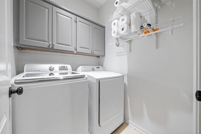6221 W 126th Ter, Overland Park, KS 66209 - washroom featuring washer and clothes dryer and cabinet space