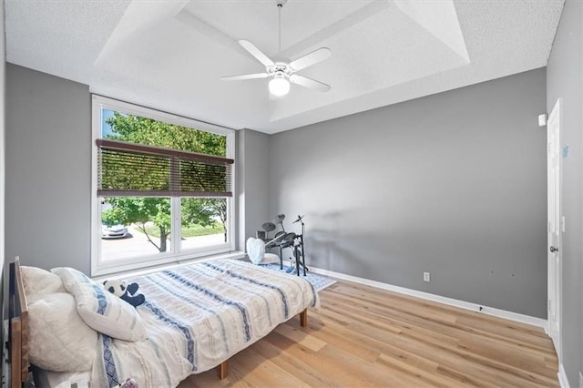6221 W 126th Ter, Overland Park, KS 66209 - bedroom featuring wood finished floors and a ceiling fan