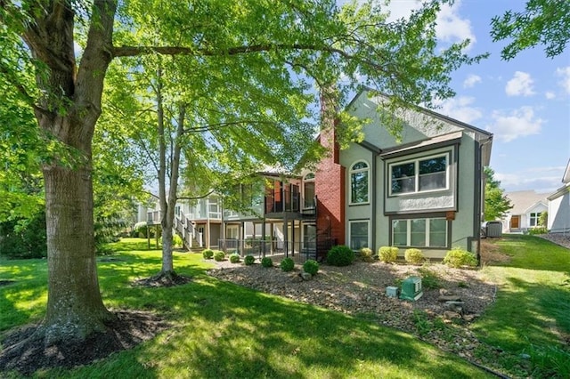 6221 W 126th Ter, Overland Park, KS 66209 - rear view of house featuring stucco siding and a yard