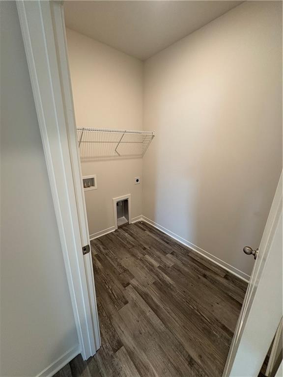 19605 W 200th St, Spring Hill, KS 66083 - washroom with hookup for an electric dryer, dark wood-style flooring, baseboards, and washer hookup