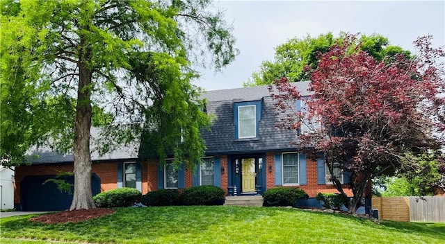 13106 E 57th St, Kansas City, MO 64133 - view of front of house featuring a garage, brick siding, a shingled roof, and asphalt driveway