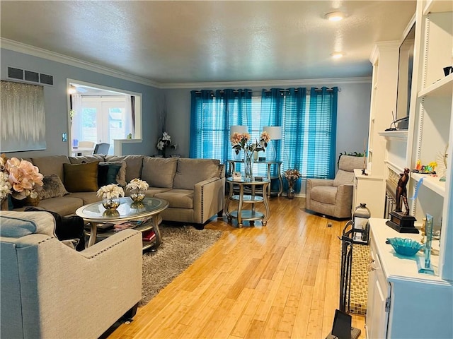 13106 E 57th St, Kansas City, MO 64133 - living room with crown molding and light wood-style flooring