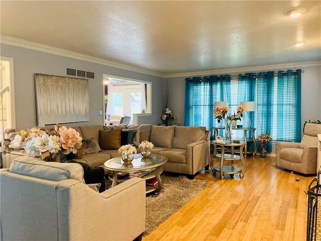 13106 E 57th St, Kansas City, MO 64133 - living area featuring ornamental molding and light wood-type flooring