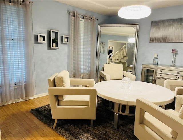 13106 E 57th St, Kansas City, MO 64133 - dining room featuring hardwood / wood-style flooring, stairs, and wine cooler