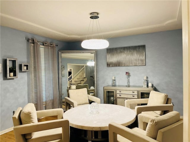 13106 E 57th St, Kansas City, MO 64133 - dining room with wine cooler, wood finished floors, and baseboards