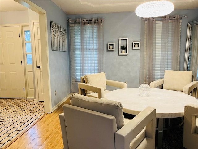 13106 E 57th St, Kansas City, MO 64133 - dining space with baseboards and light wood-style flooring