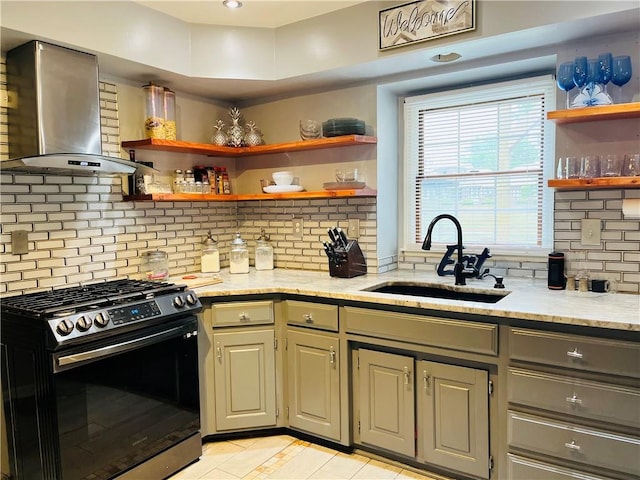 13106 E 57th St, Kansas City, MO 64133 - kitchen with stainless steel range with gas cooktop, wall chimney exhaust hood, open shelves, a sink, and backsplash