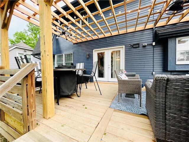 13106 E 57th St, Kansas City, MO 64133 - wooden deck with a pergola, french doors, and outdoor dining space