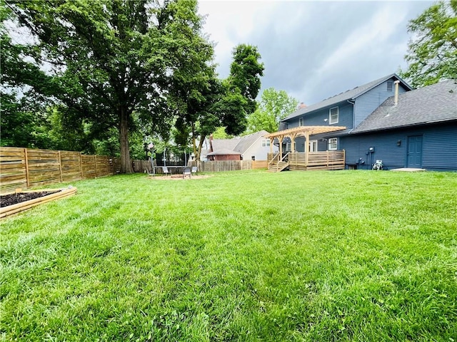 13106 E 57th St, Kansas City, MO 64133 - view of yard with a deck