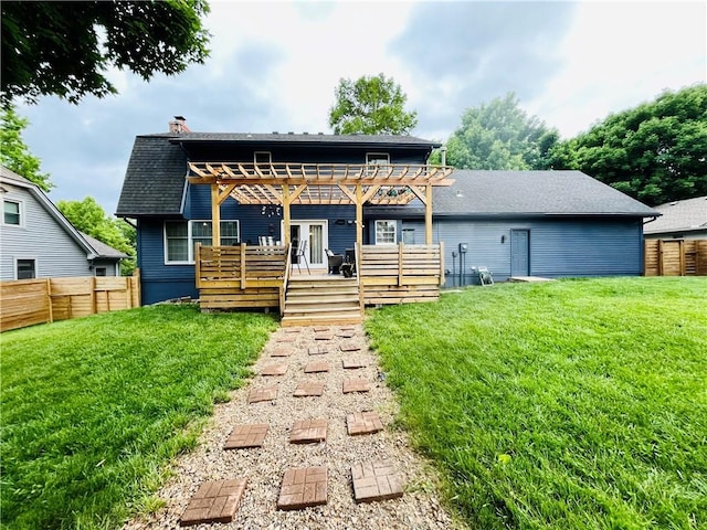 13106 E 57th St, Kansas City, MO 64133 - rear view of house featuring a pergola, a chimney, a wooden deck, and roof with shingles
