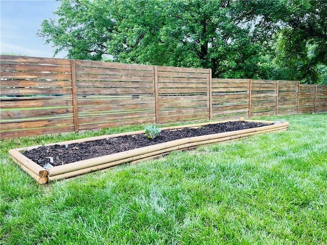 13106 E 57th St, Kansas City, MO 64133 - view of yard with a vegetable garden