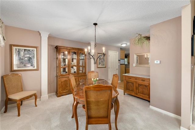 800 Ash Ct, Lansing, KS 66043 - dining area featuring light colored carpet, a chandelier, and baseboards
