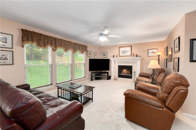 800 Ash Ct, Lansing, KS 66043 - living room with a ceiling fan, light colored carpet, a glass covered fireplace, and baseboards