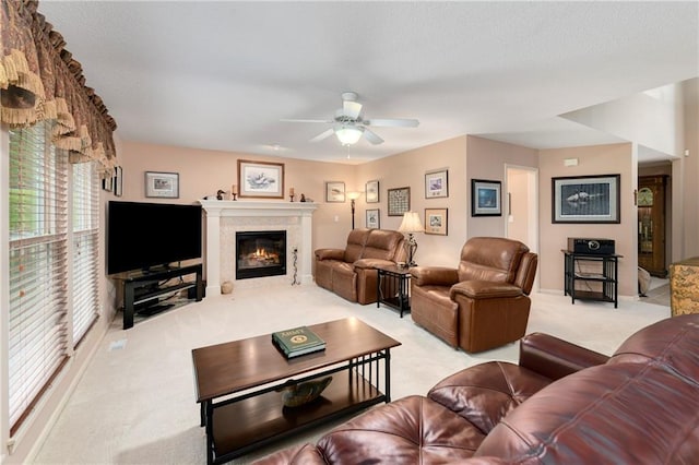 800 Ash Ct, Lansing, KS 66043 - living area featuring light carpet, ceiling fan, a glass covered fireplace, and baseboards