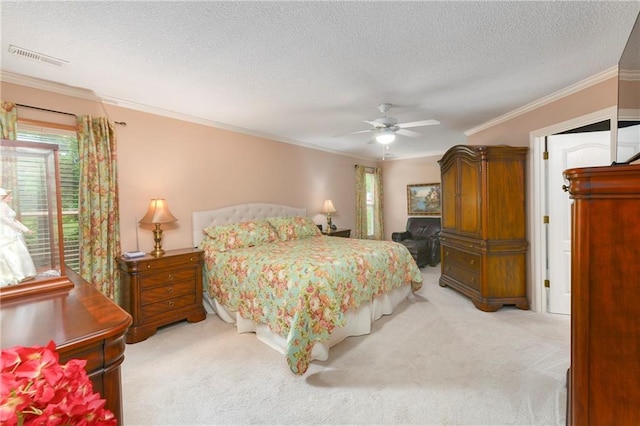 800 Ash Ct, Lansing, KS 66043 - bedroom featuring light colored carpet, ornamental molding, a textured ceiling, and a ceiling fan